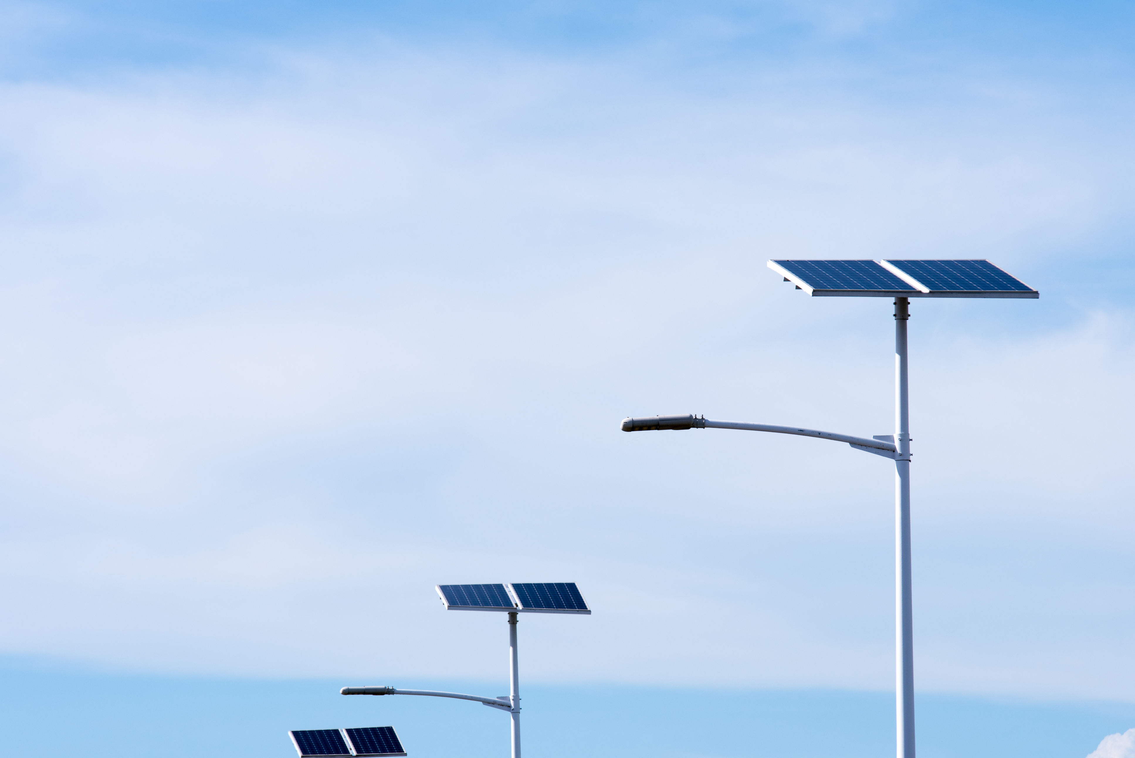 low-angle-view-street-light-with-solar-panels-against-sky